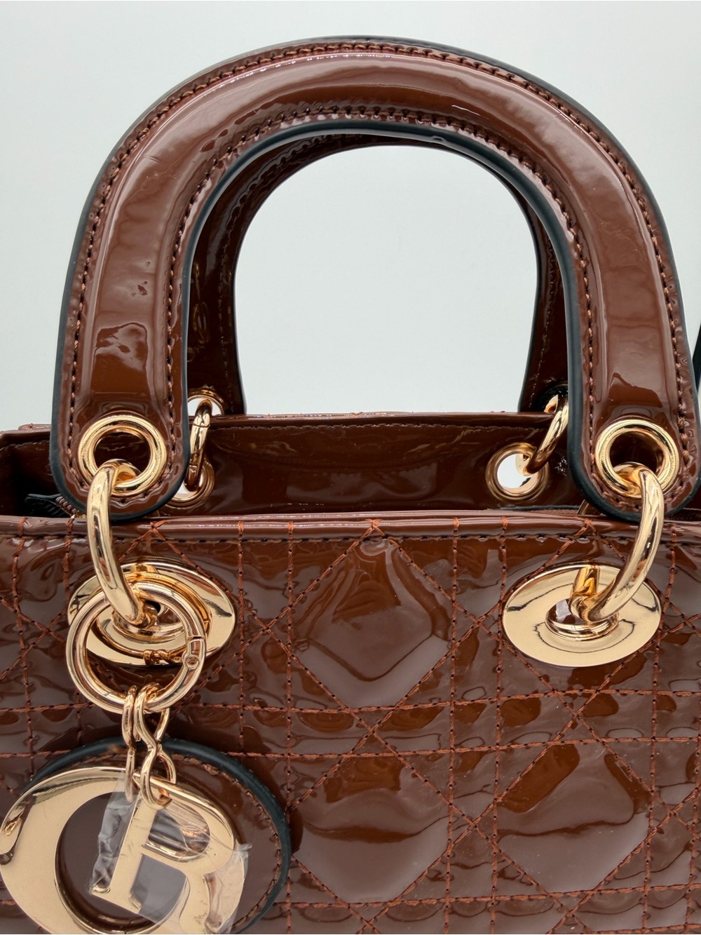 Beautiful, Brown Patent leather mini Bag with Gold Charm - Picture 6 of 15